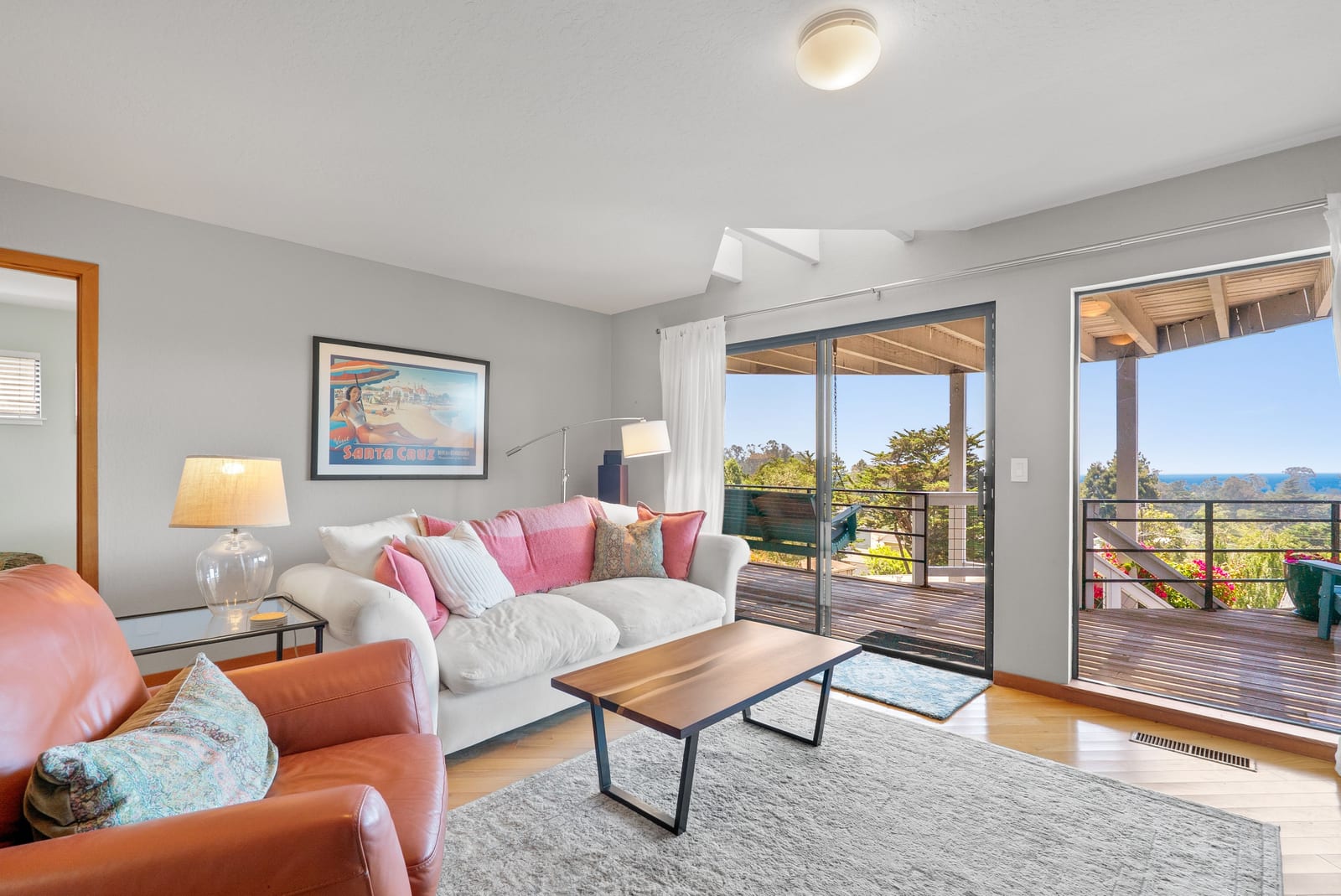 Family room with doors opening to the outdoor deck
