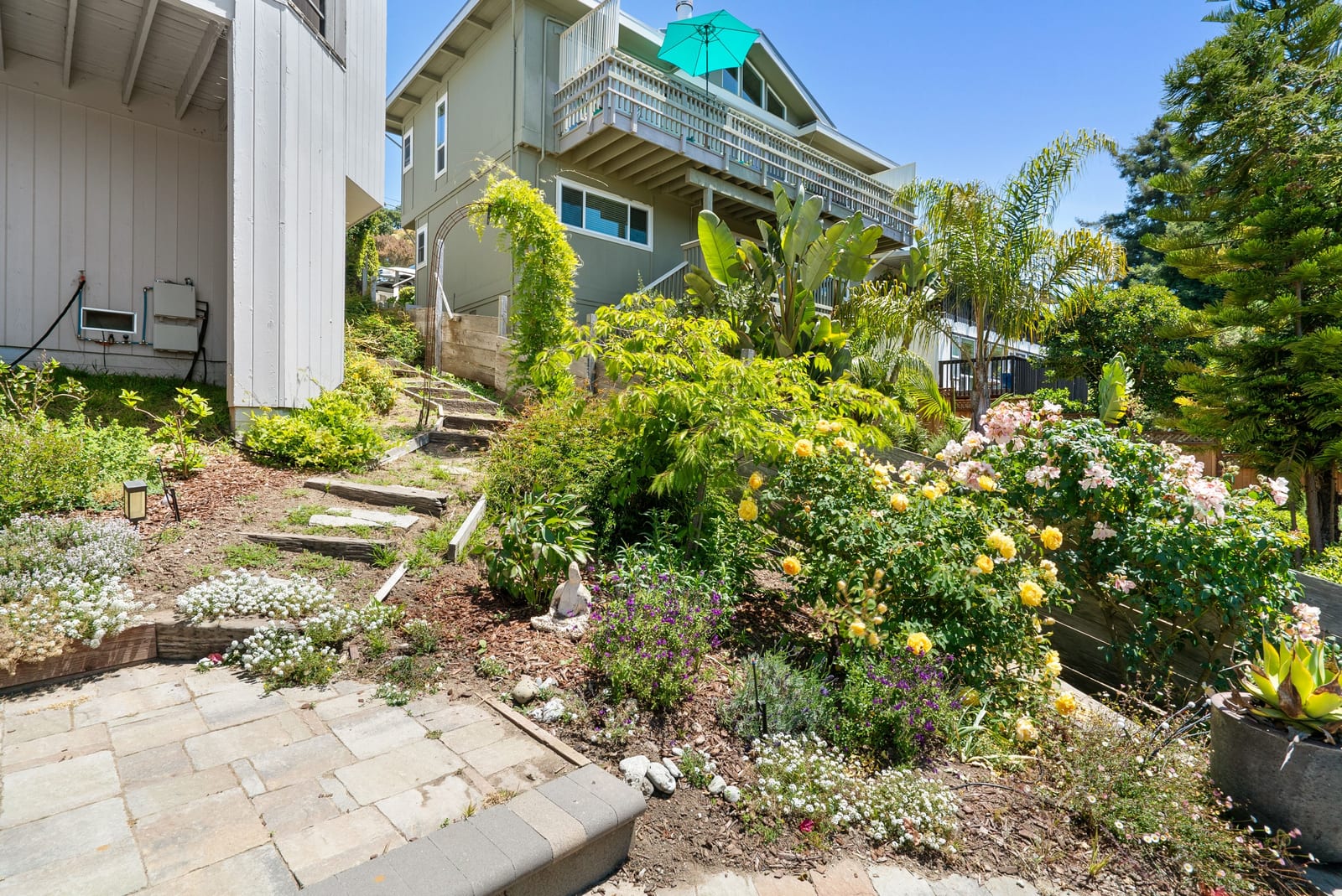 Home and decks rising above the terraced garden